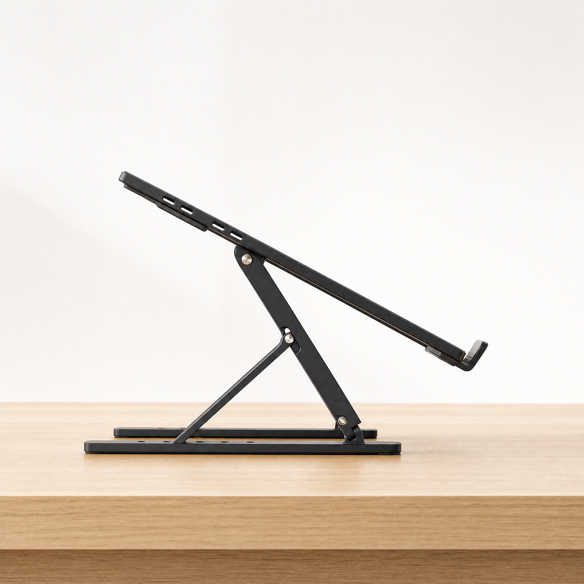 Side view of the laptop stand showing the six height adjustment notches