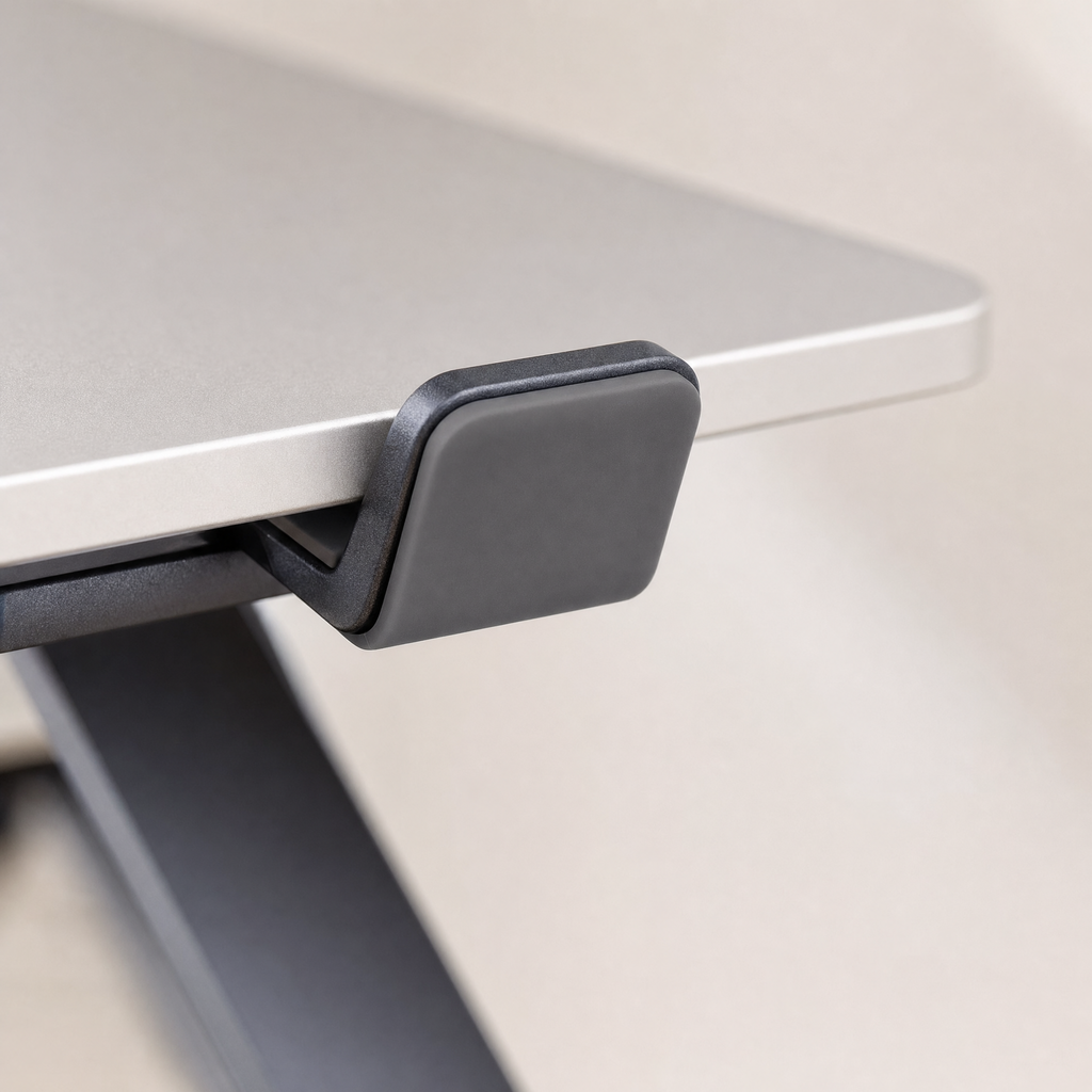 Close detail of a silicone pad gripping the front edge of the laptop